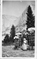 Anglo tourist examining Acorn Granaries - "chuck-ah". Note: original was not sharp.