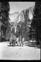 Mrs. Roosevelt in front of the Yosemite Falls. Left to right: Charlie Rich, Secret Service; Chief Ranger Townsley; Supt. Lawrence Merriam; Miss Thompson, Sec'y; Mrs. Roosevelt; Mrs. Merriam