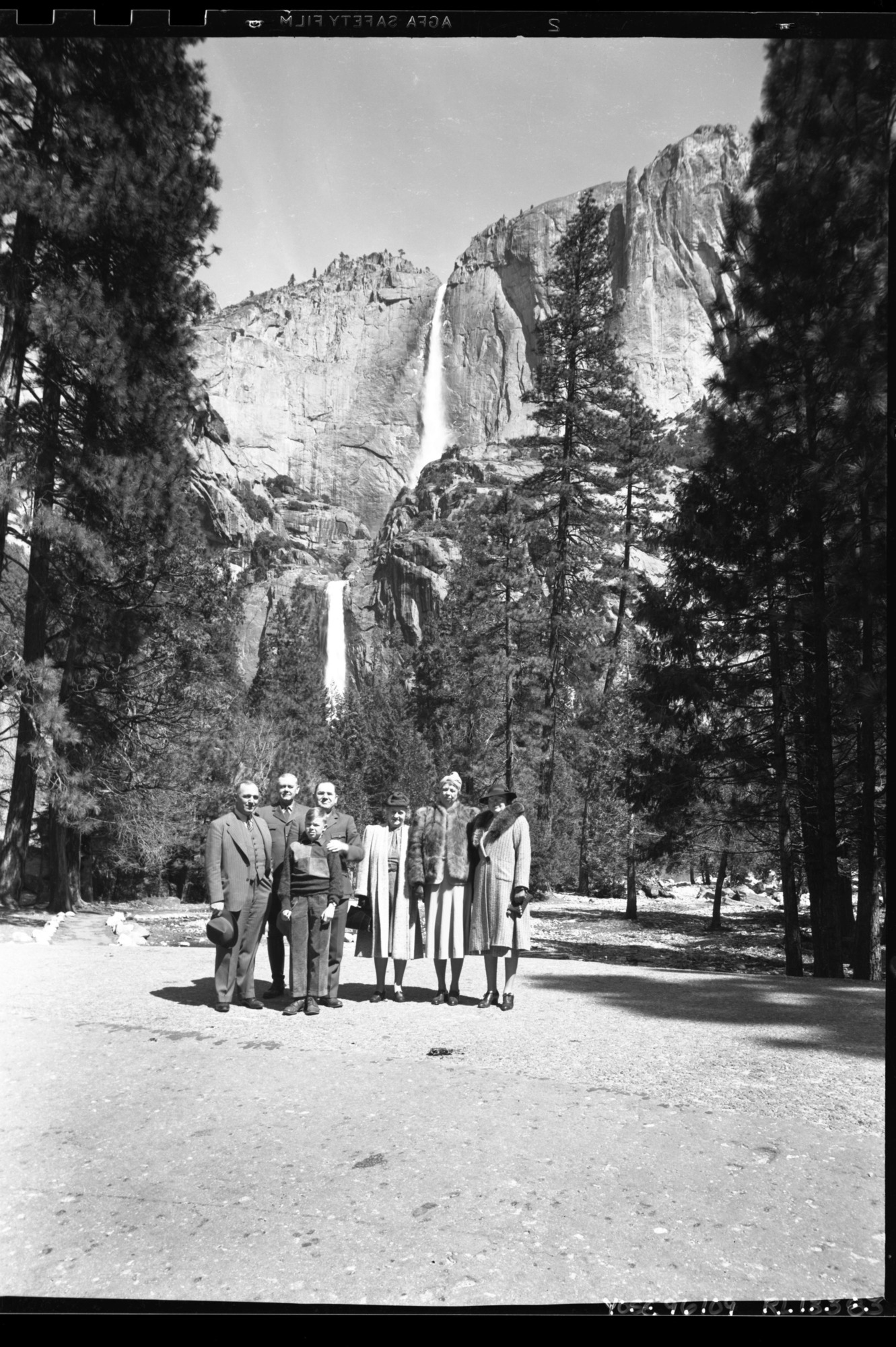Mrs. Roosevelt in front of the Yosemite Falls. Left to right: Charlie Rich, Secret Service; Chief Ranger Townsley; Supt. Lawrence Merriam; Miss Thompson, Sec'y; Mrs. Roosevelt; Mrs. Merriam