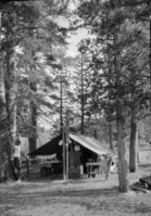 Copy Neg: (CP) L. Radanovich, 11/2002. "Devils Postpile Nat. Monument Ranger Station. Ranger Gage erecting radio aerial for communication."