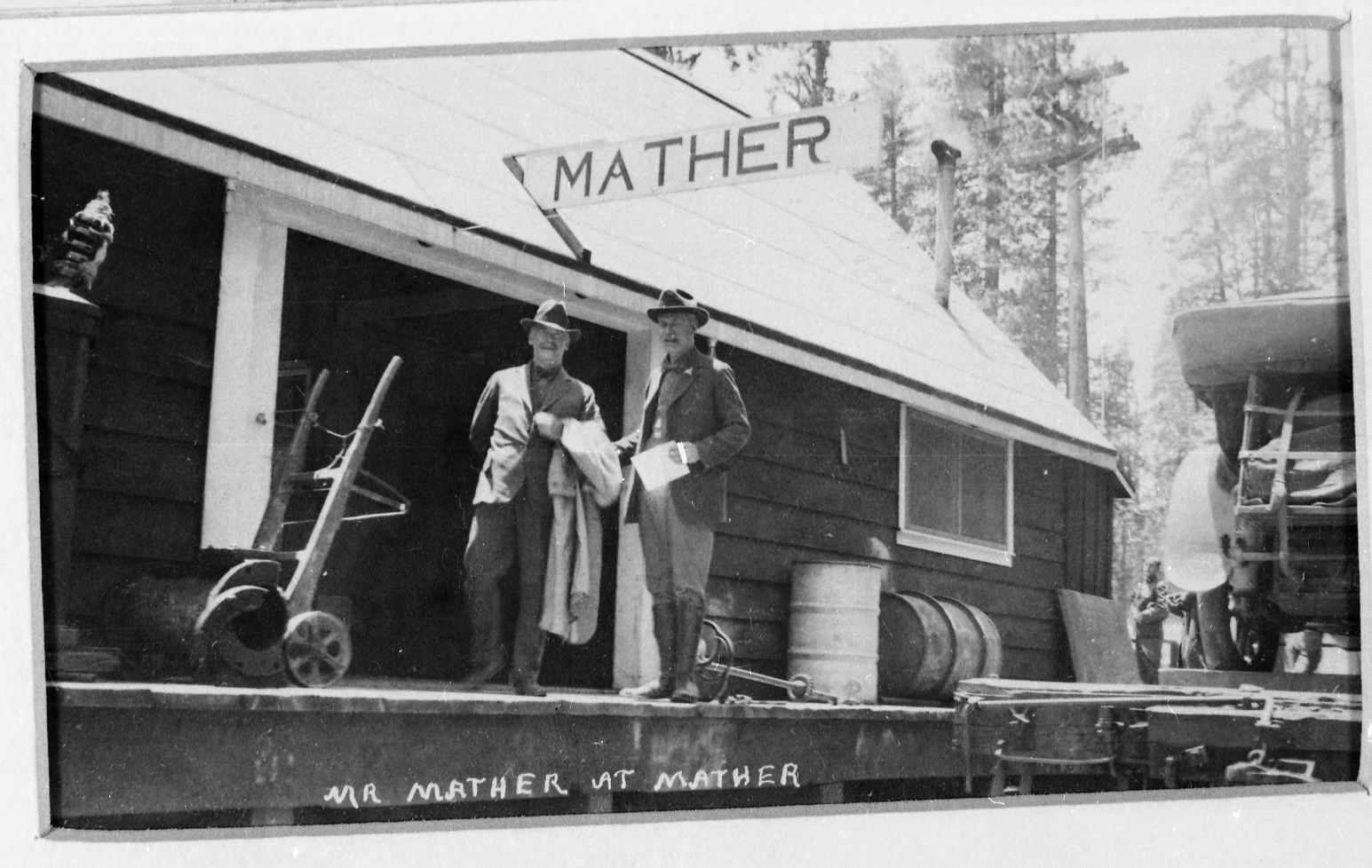 Copy Neg: J. Ernest, 1983. Stephen Mater on right at Mather. Original print in over-sized photo drawer in RL.