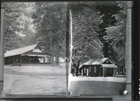 Galen Clark's cabin (right); Later this was Jack Gaylor's house-removed about 1923 (Left of same neg. Camp Lost Arrow); [On neg file]: Photo on left: Camp Lost Arrow- Camp closed in 1916, operated by William Sell Jr. Photo on right: Galen Clark's cabin- Office of the Guardian of Yosemite Valley & Mariposa Grove.