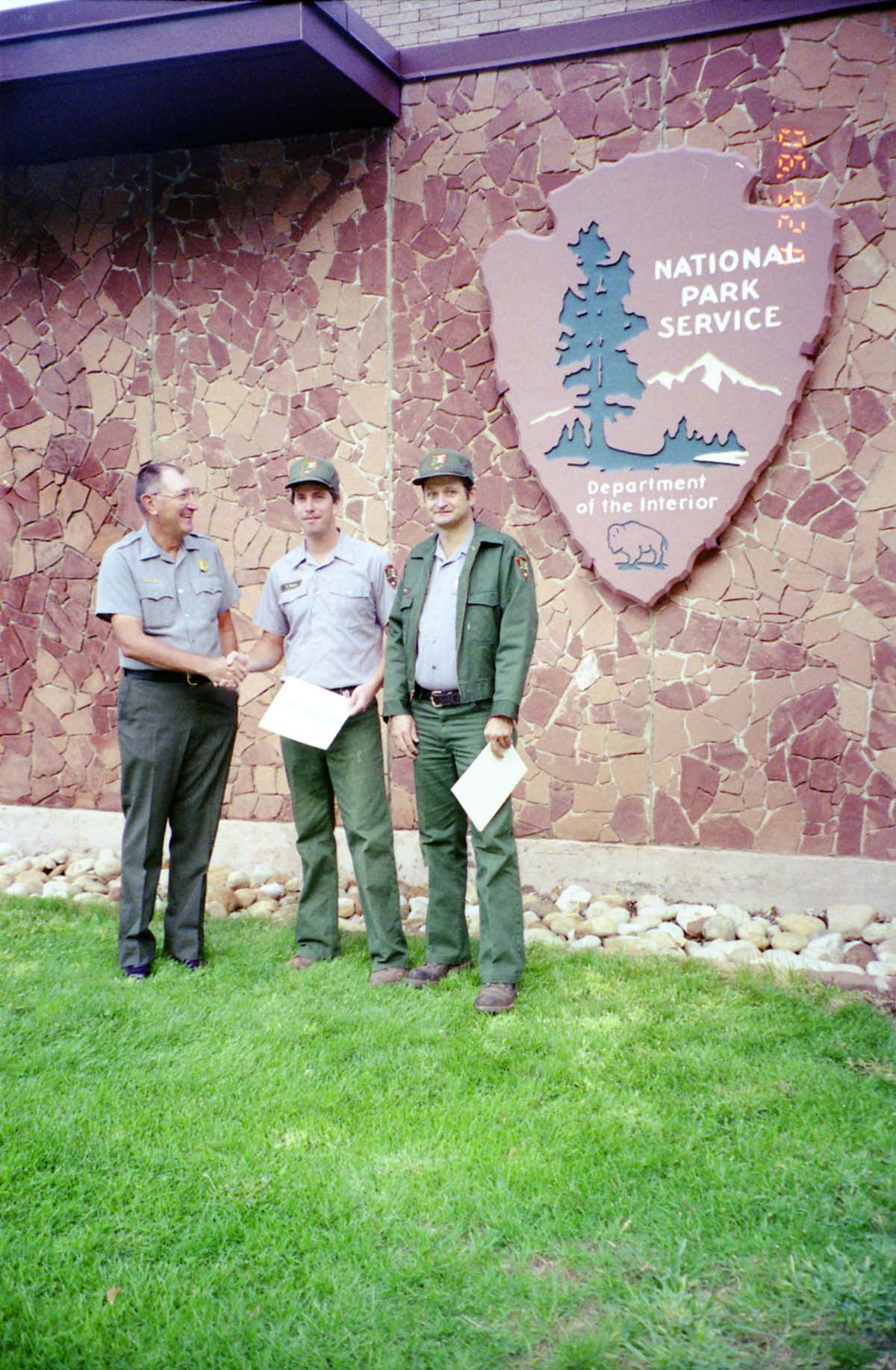 Color Photos of Superintendent Harold Grafe giving out awards to park personnel.