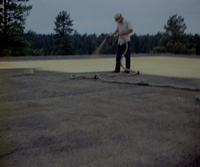 Man spraying foam sealant during reroofing project. Bryce Canyon National Park.