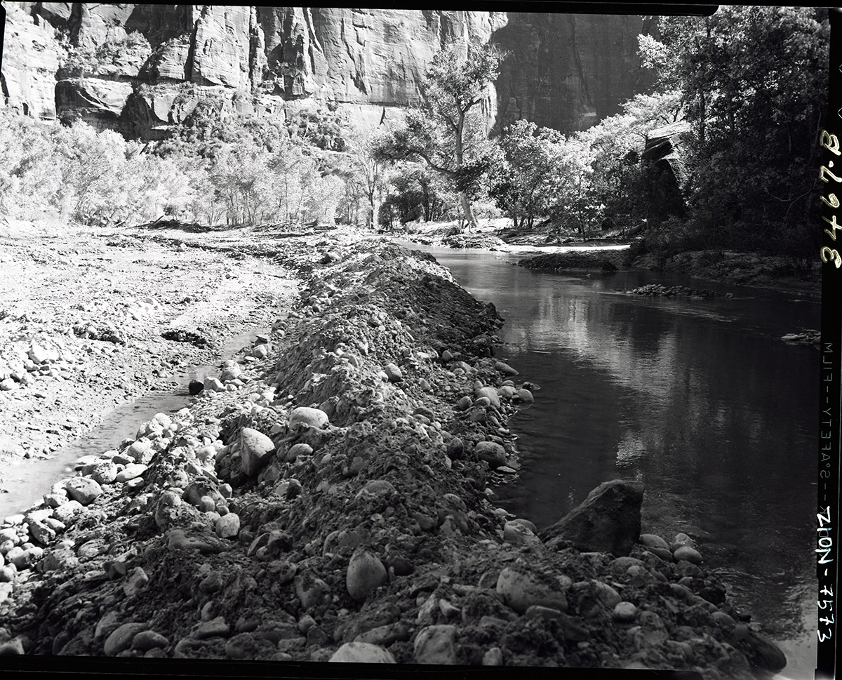 Road repair of flood damage, valley road diverted Virgin River so damage could be repaired.