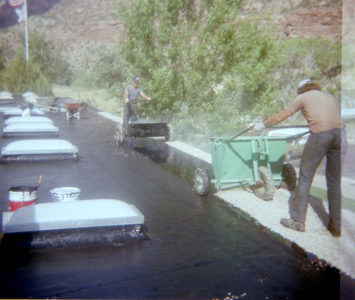 Man operating roofing machine during the headquarters/visitor center roofing project.