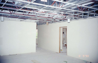 Park Headquarters Renovation: man painting in west corner hallway and offices, upper level.