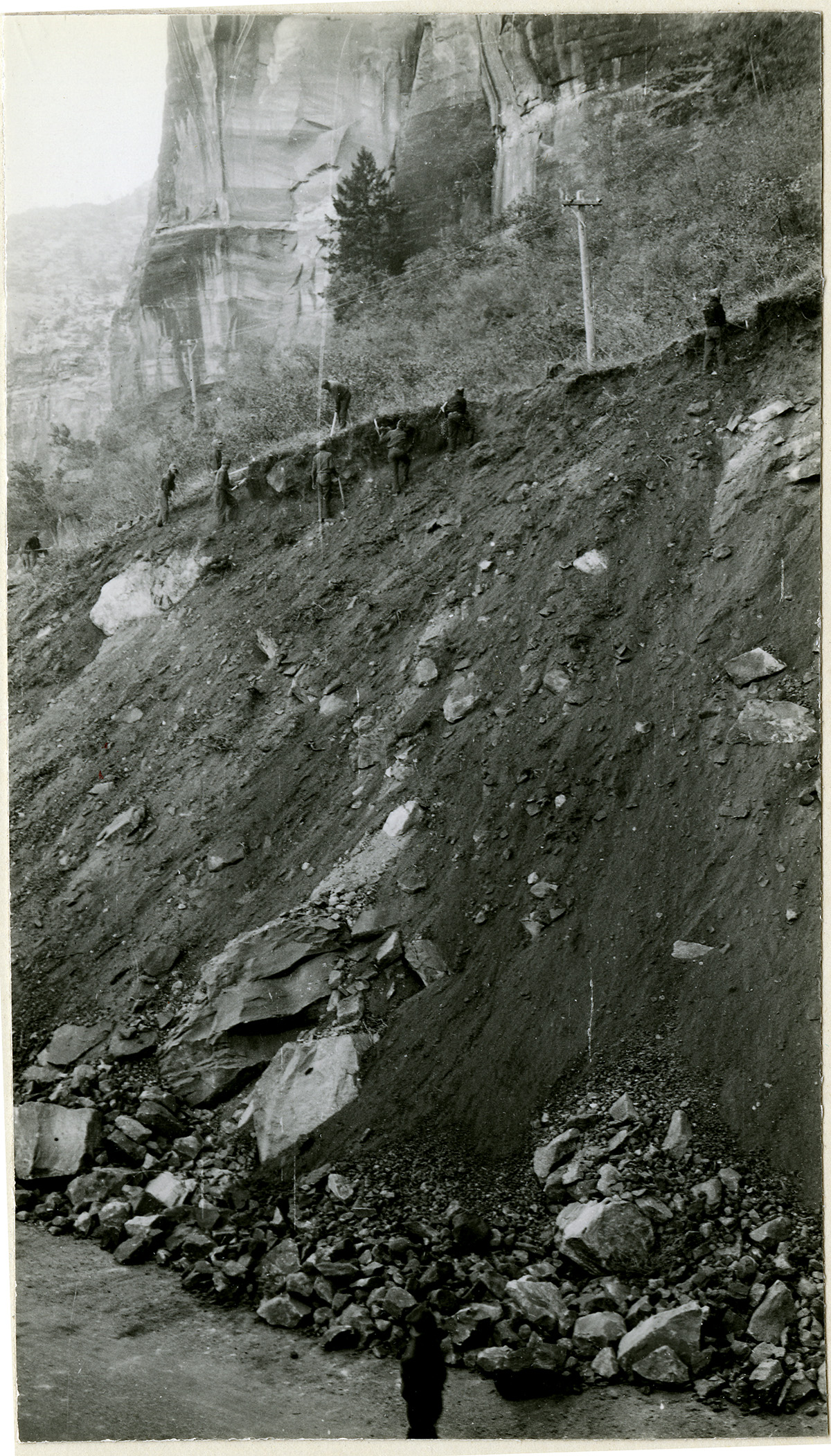 Workers engaged in bank stabilization above the Zion Mt Carmel Highway.