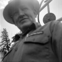 BW Photos of road repairs at Cedar Breaks. Man standing by equipment.