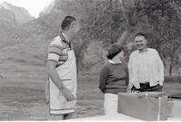 BW Photos of the Crocker/ Nicholson retirement barbeque. Superintendent Harold Grafe in apron speaking.
