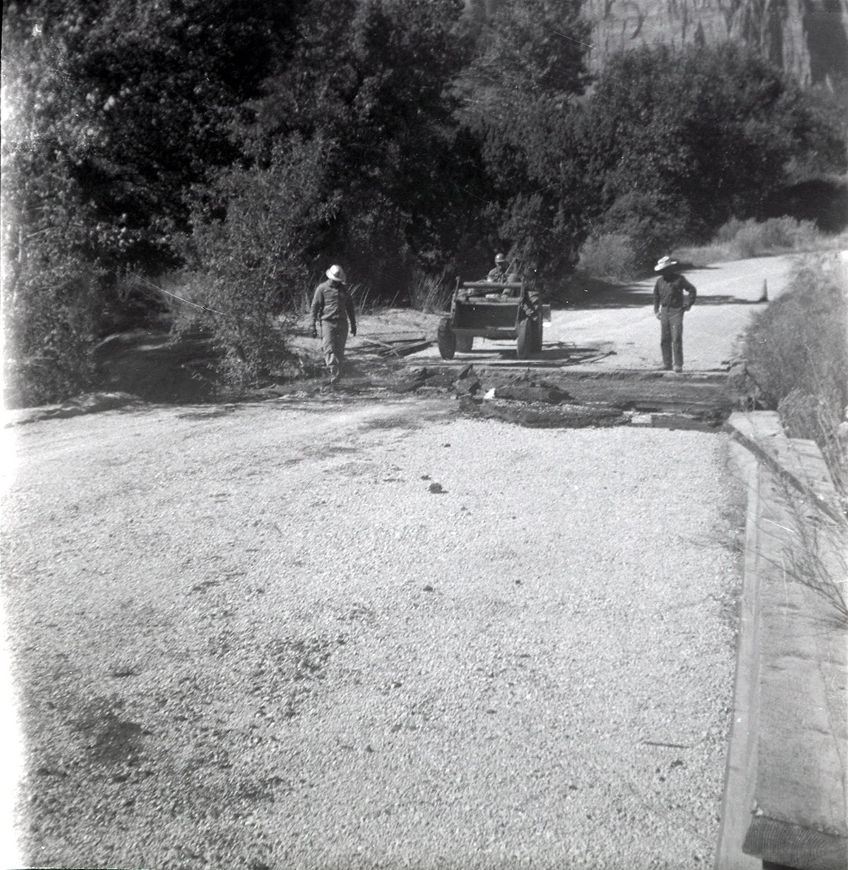 Men repairing section of the road along the scenic canyon drive near the Grotto.