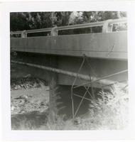 Piping system on underside of bridge during the Watchman housing utility project.