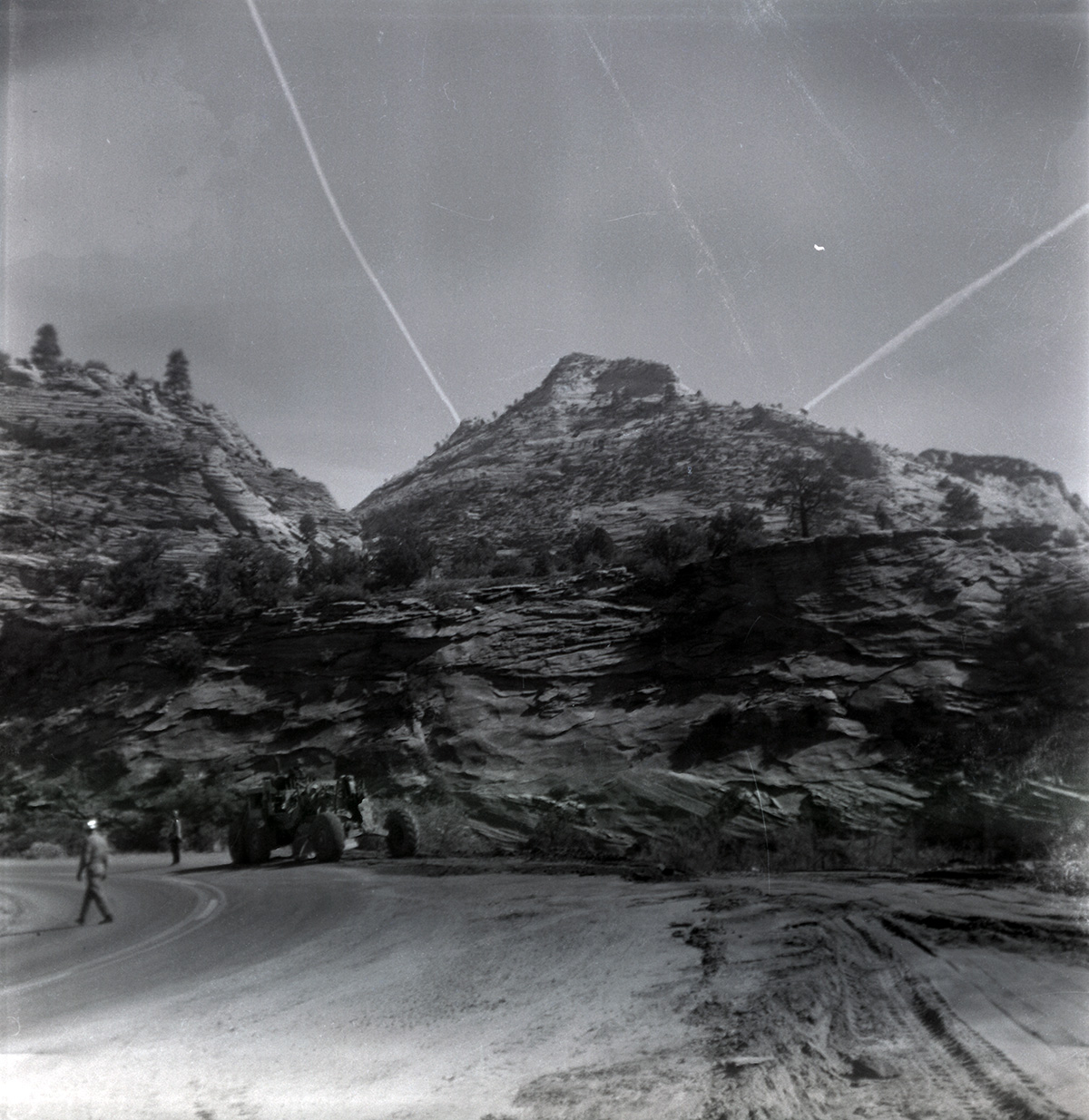 Men working on road repair and turn out construction on the East side.