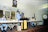 Color Photos of John Lancaster's farewell party at Elks Club in St. George, Utah. Speakers at roast in front of room: Pipe Spring National Monument Superintendent, TWA Steve Tedder, Chief of Maintenance, Chief Naturalist, John Lancaster, Crazy D, Administrative Officer, Cedar Breaks National Monument Superintendent, Chief Ranger, Unknown Skier.