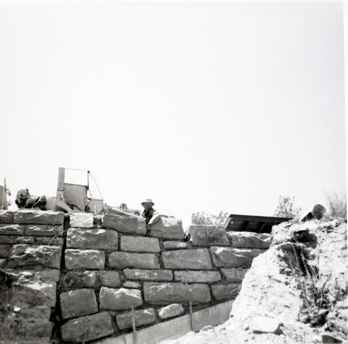Brick retaining wall along East Rim road during repairs.