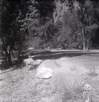 Road lined with stones leading to parking area near the Grotto.