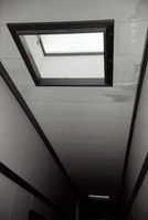 Ceiling and skylights in hallway of barracks. [Image possibly for comparative housing study]