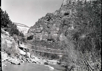 Suspension bridge across Virgin River, West Rim Trailhead rebuilt and relocated in spring of 1953.