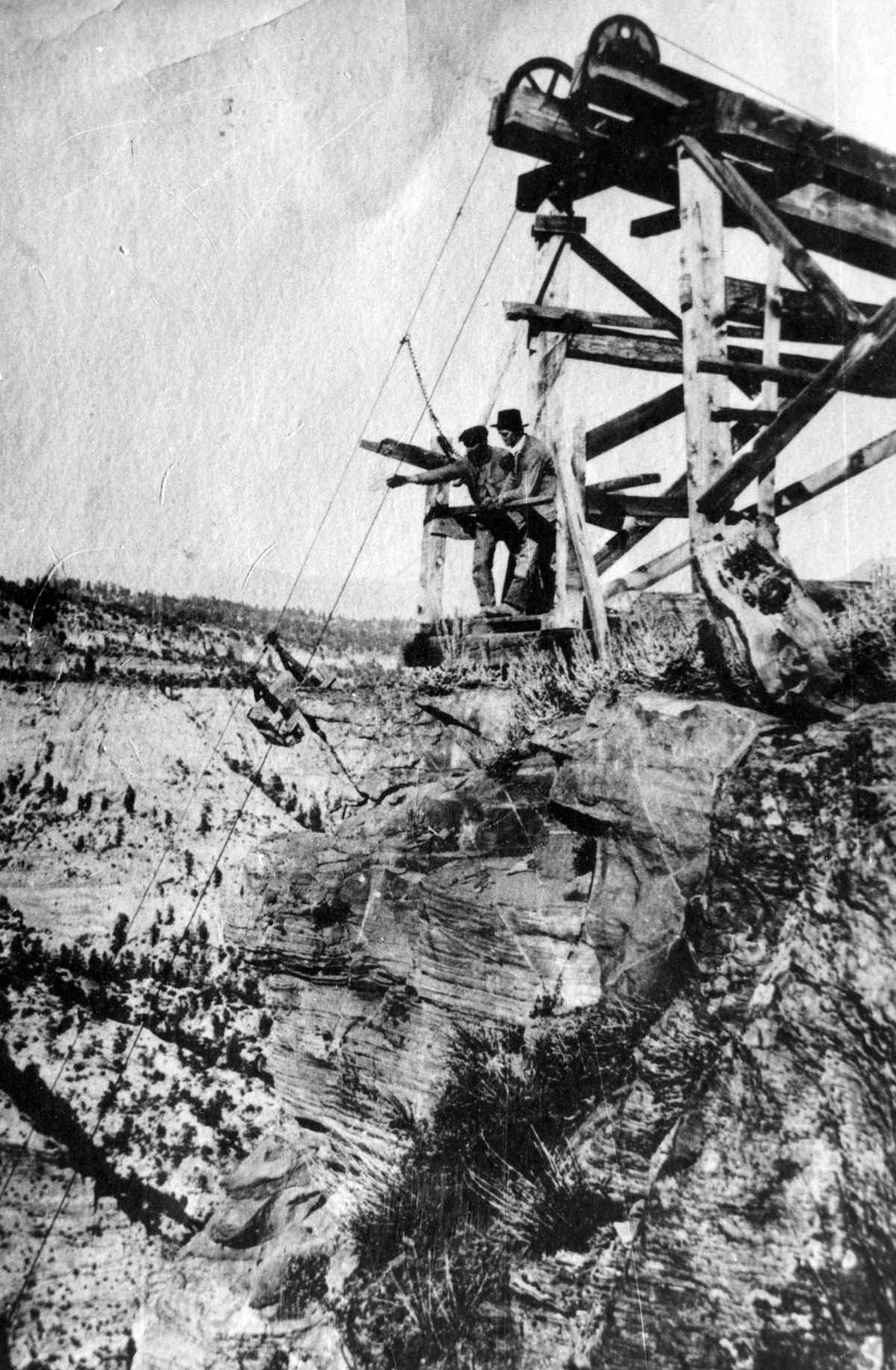 Cableworks above Zion Canyon, with William L. Crawford, and either John Winder or Mr. Rosencranz at edge of cable works, east rim of Zion Canyon.