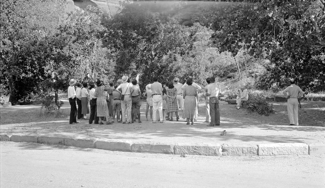 Visitors on a ranger-led hike at the beginning of the Narrows Trail.
