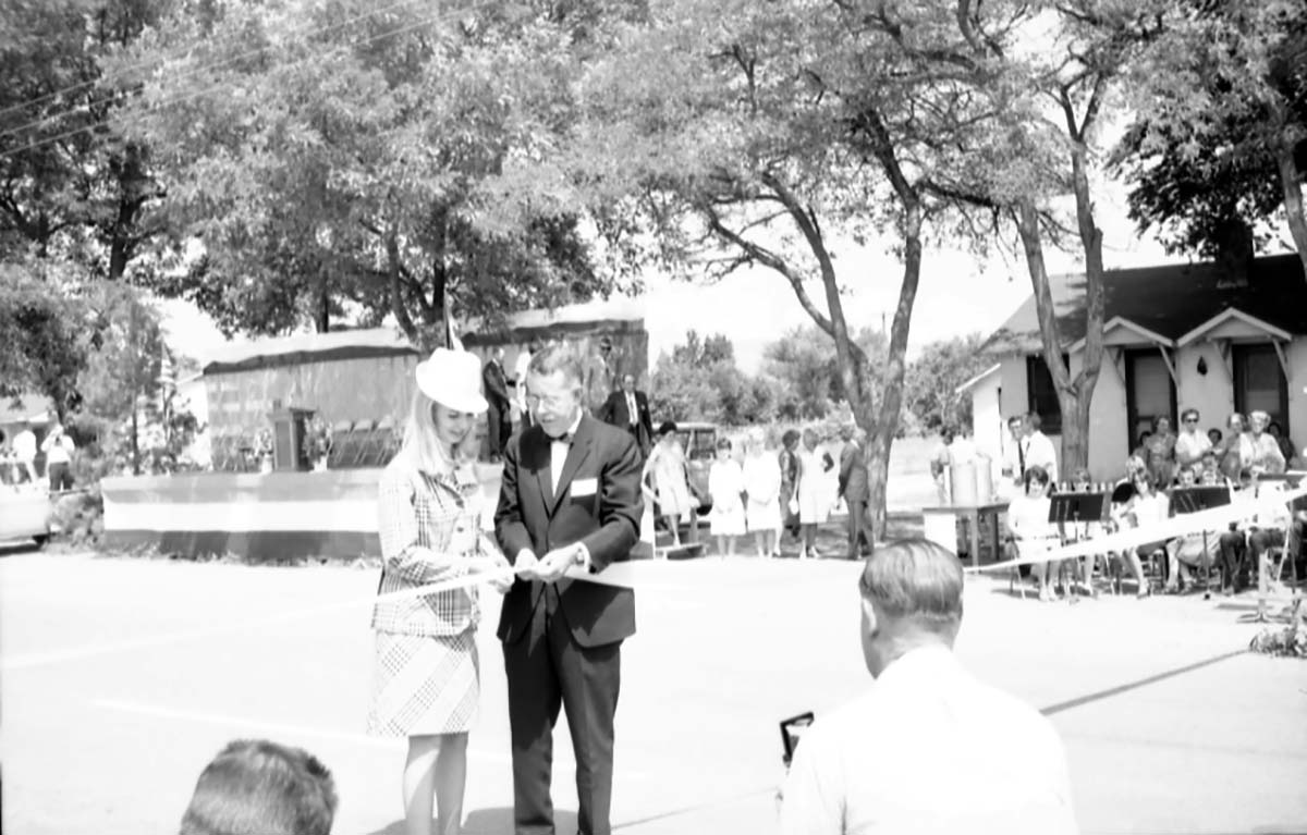 Crowd watching as Arizona Governor Jack Williams and 'Miss Fredonia' cut the ribbon at the dedication ceremony of Arizona State Highway 389, Fredonia, Arizona, August 5, 1967.