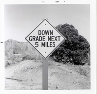 Road sign reading 'Down Grade Next 5 Miles' in Kolob Canyon.