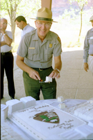 Color Photos of the parks 72nd anniversary celebrations- cake cutting, barbecue, speakers. Superintendent Harold Grafe serving cake.