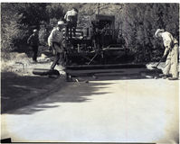 Road repair - near ranger dorm. Paving machinery at work laying hot mix.