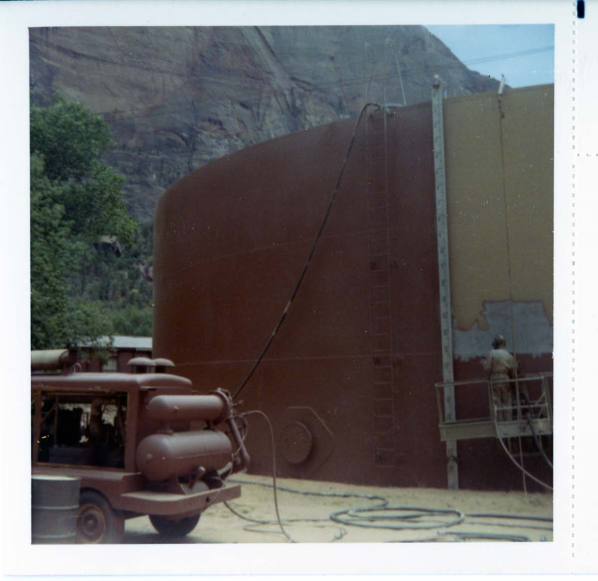 Repainting the exterior of the million gallon water tank at Birch Creek.