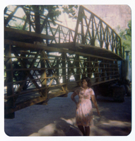 Woman standing in front of bridge material during arrival and emplacement of three new footbridges in Zion Canyon.
