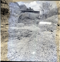 Bulldozer packing new road and covering culverts for the new Highway 1 (State Route 9) from South Entrance to the Mission 66 Visitor Center and Museum.