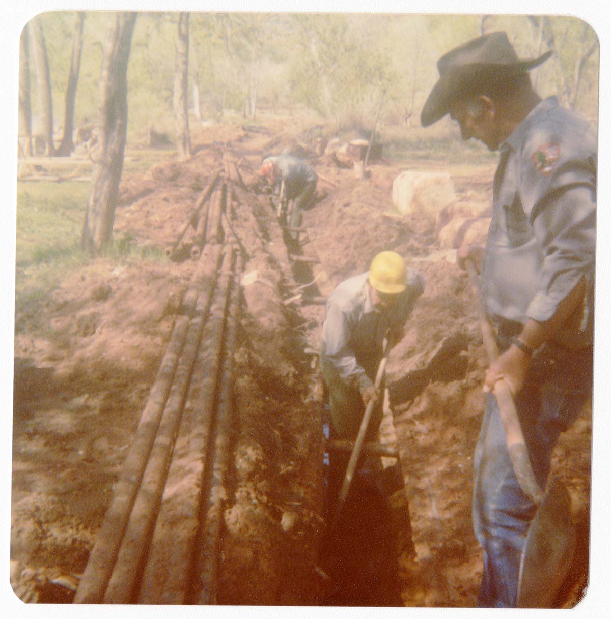 Workers uncovering the irrigation ditch in South Campground.