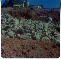 Men piling rocks during road work/repair in Kolob Canyon.