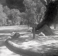 Sign stating 'Picnicking and camping only in established campground' near the Grotto.