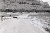 Entrance gate with campers in the background at the Watchman Campground.