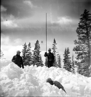 BW Photos showing rangers digging out the visitor center from snowdrift.