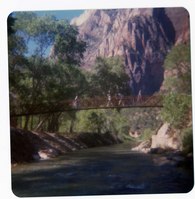 People walking on new Grotto footbridge over the Virgin River. Note riverbank revetments at left.