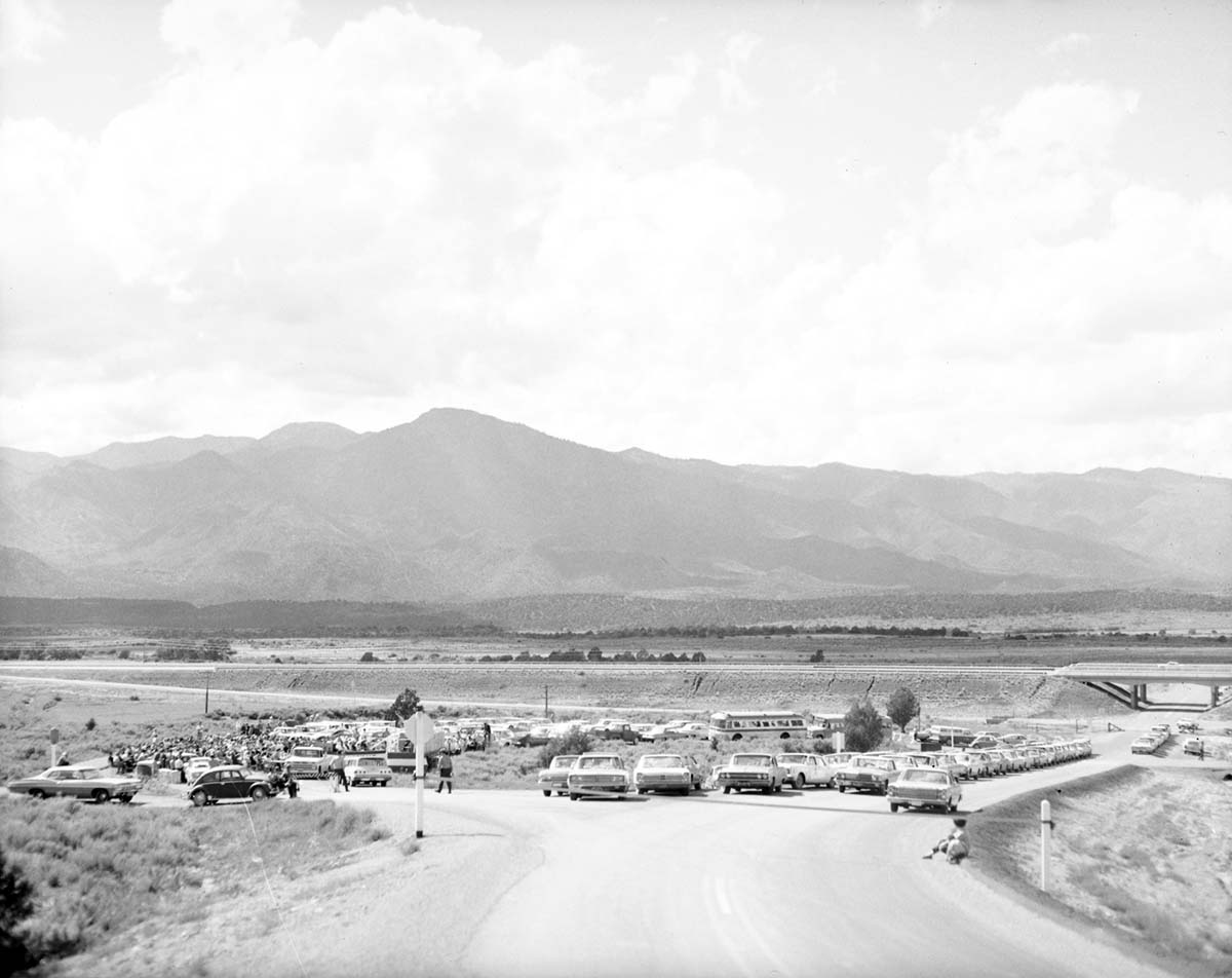 Ribbon tied across road, in front of visitor seating and parking areas at the dedication of Taylor Creek road (Kolob Canyons).