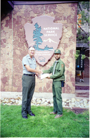 Color Photos of Superintendent Harold Grafe giving out awards to park personnel.