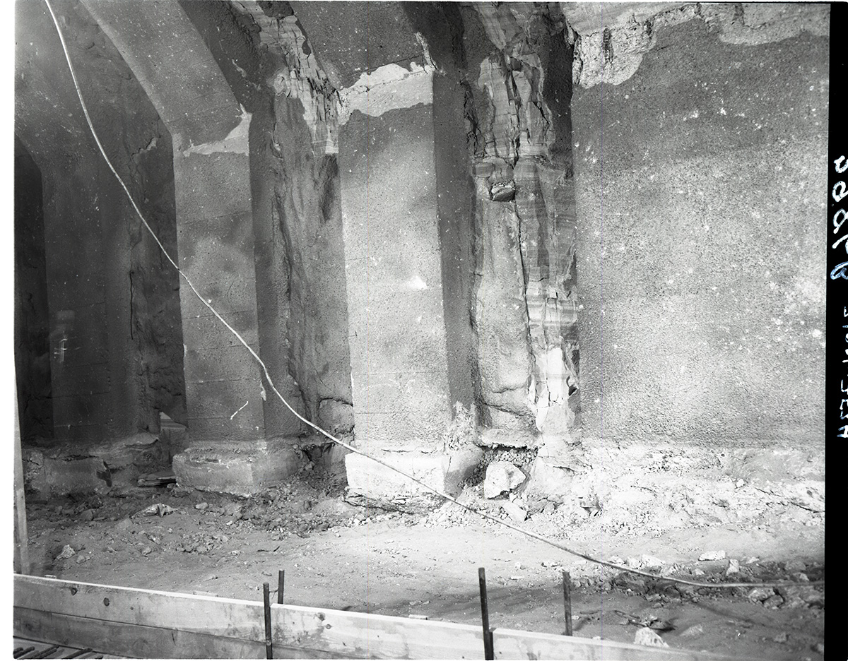Shattered condition of tunnel wall, illustrating need for repair and the danger of the work in removing debris from footings.