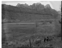 Albert E. Jones property, east of Virgin River, south of park boundary, three men standing near the fence.