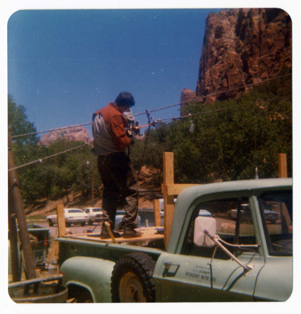 Worker setting up the tramline for the transportation of equipment for the construction of Wiley Tank.