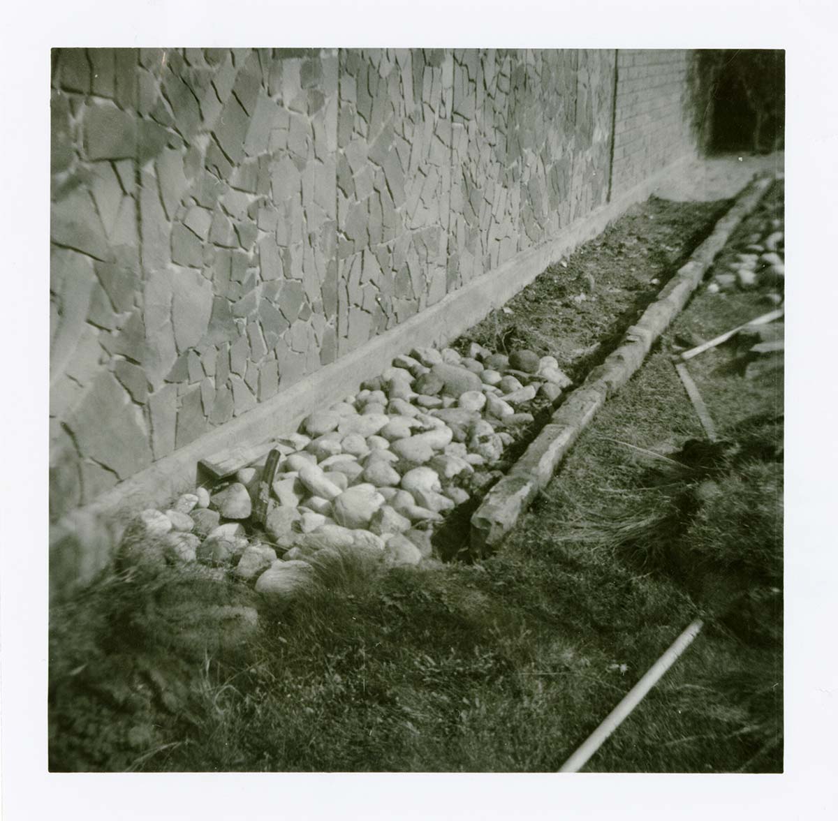 Stone and grass landscaping along the exterior of the old Mission 66 Visitor Center and Museum.