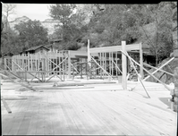 Rebuilding Zion Lodge after fire of January 28, 1966 - walls and ceilings of much of lodge in place.