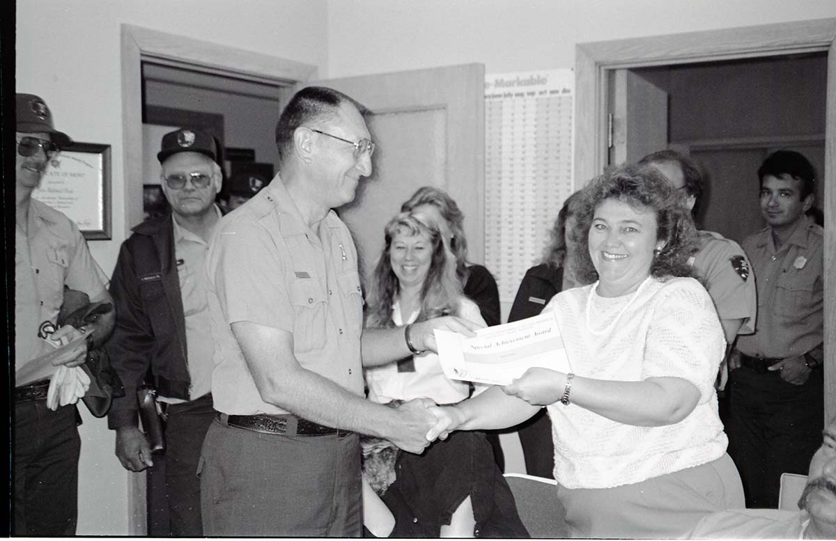BW Photos of Superintendent Harold Grafe giving out awards to park personnel.