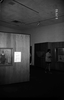 Visitor viewing the interpretive display in the old Mission 66 Visitor Center and Museum.