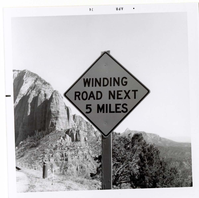 Road sign reading 'Winding Road Next 5 Miles' in Kolob Canyon.