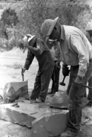 Jim Felton and Sheldon Olsen (center) demonstrates stone cutting and rock work. Second annual Folklife Festival, Zion National Park Nature Center on September 1978.