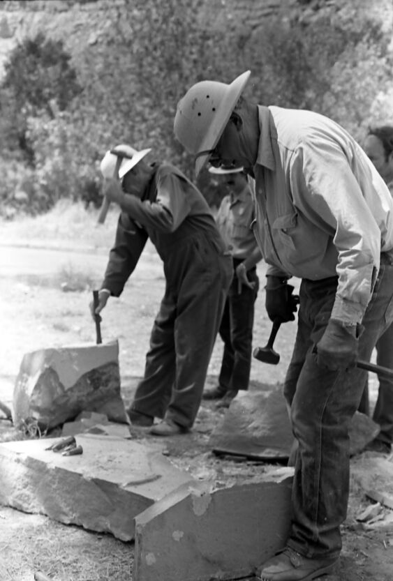 Jim Felton and Sheldon Olsen (center) demonstrates stone cutting and rock work. Second annual Folklife Festival, Zion National Park Nature Center on September 1978.