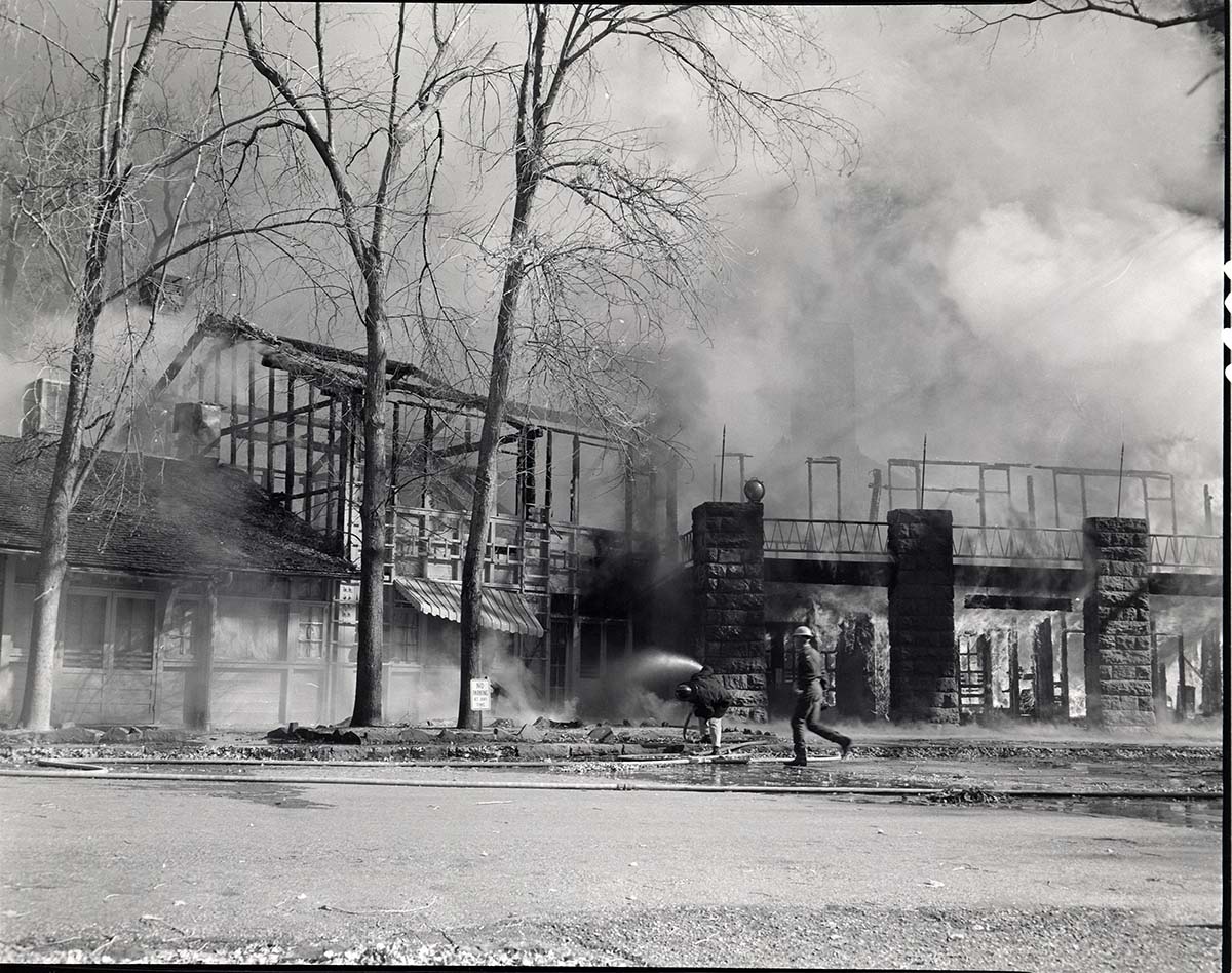 Destructive fire in the Zion Lodge, fire fighters and burning building.